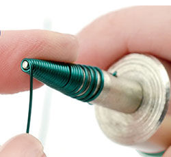 Wire being wrapped around mandrel